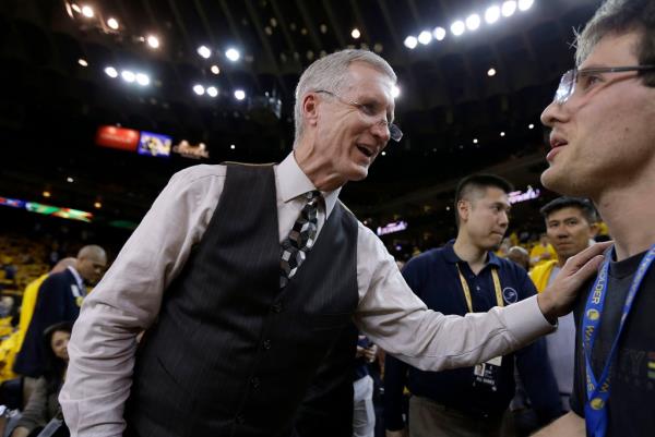 Mike Breen, NBA play-by-play sports commentator for ABC, greets fans before Game 1 of basketball's NBA Finals between the Golden State Warriors and Cleveland Cavaliers on June 4, 2015