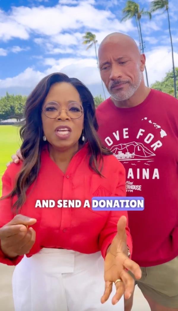 Oprah and Dwayne Johnson talking to a camera together. 
