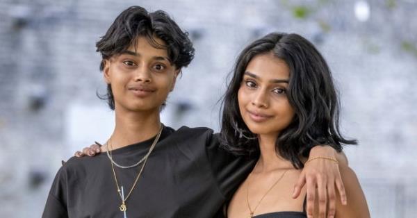 **Sent under embargo ? no use before 14.00BST October 1 2023** Twins Suchita (right) and Savita (left) Naidu (21). Photo released October 1 2023. See SWNS story SWMRtwins. Meet the identical twins who couldn't be more different - a girlie-girl Miss England beauty queen finalist and a self-co<em></em>nfessed tom-boy who became a trans man. Suchita and Savita Naidu, aged 21, grew up as biological sisters but have now been brother and sister for the past three years after Savita transitio<em></em>ned to a male. The pair were born five minutes apart in Camden, North London, before moving to Malaysia in 2005 when they were three-years-old. Despite being identical on the outside, that is wher<em></em>e the similarities ended and it was apparent the pair were different even from the age of two. Suchita loved make-up sets, Barbie dolls and anything pink while Savita refused to wear dresses and loved motorbikes, cars, football and superheroes. Suchita said she didn't even recognise her sister as a girl while they were growing up while Savita knew inside she was different from the age of five. The twins moved back to Britain, aged 10, with their parents and two elder sisters in 2012 to live in Watford and attended Watford Grammar School for Girls. Savita came out as gay in Year 9 in 2016 and as trans man in 2020 at the end of their A-Levels which brought them closer together than ever before. Three years later, Savita is now preparing to support sister Suchita after she reached the Miss England semi-finals.