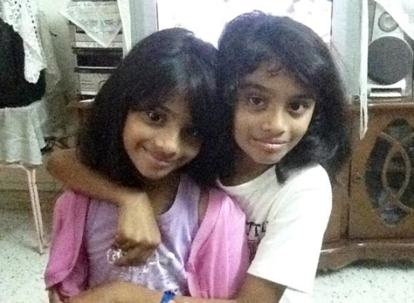 **Sent under embargo ? no use before 14.00BST October 1 2023** COLLECT - Suchita (left) & Savita (right) Naidu when younger. Photo released October 1 2023. See SWNS story SWMRtwins. Meet the identical twins who couldn't be more different - a girlie-girl Miss England beauty queen finalist and a self-co<em></em>nfessed tom-boy who became a trans man. Suchita and Savita Naidu, aged 21, grew up as biological sisters but have now been brother and sister for the past three years after Savita transitio<em></em>ned to a male. The pair were born five minutes apart in Camden, North London, before moving to Malaysia in 2005 when they were three-years-old. Despite being identical on the outside, that is wher<em></em>e the similarities ended and it was apparent the pair were different even from the age of two. Suchita loved make-up sets, Barbie dolls and anything pink while Savita refused to wear dresses and loved motorbikes, cars, football and superheroes. Suchita said she didn't even recognise her sister as a girl while they were growing up while Savita knew inside she was different from the age of five. The twins moved back to Britain, aged 10, with their parents and two elder sisters in 2012 to live in Watford and attended Watford Grammar School for Girls. Savita came out as gay in Year 9 in 2016 and as trans man in 2020 at the end of their A-Levels which brought them closer together than ever before. Three years later, Savita is now preparing to support sister Suchita after she reached the Miss England semi-finals.