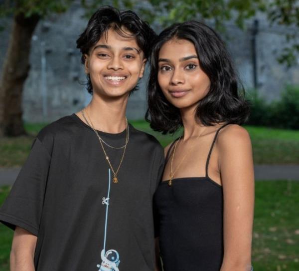 **Sent under embargo ? no use before 14.00BST October 1 2023** Twins Suchita (right) and Savita (left) Naidu (21). Photo released October 1 2023. See SWNS story SWMRtwins. Meet the identical twins who couldn't be more different - a girlie-girl Miss England beauty queen finalist and a self-co<em></em>nfessed tom-boy who became a trans man. Suchita and Savita Naidu, aged 21, grew up as biological sisters but have now been brother and sister for the past three years after Savita transitio<em></em>ned to a male. The pair were born five minutes apart in Camden, North London, before moving to Malaysia in 2005 when they were three-years-old. Despite being identical on the outside, that is wher<em></em>e the similarities ended and it was apparent the pair were different even from the age of two. Suchita loved make-up sets, Barbie dolls and anything pink while Savita refused to wear dresses and loved motorbikes, cars, football and superheroes. Suchita said she didn't even recognise her sister as a girl while they were growing up while Savita knew inside she was different from the age of five. The twins moved back to Britain, aged 10, with their parents and two elder sisters in 2012 to live in Watford and attended Watford Grammar School for Girls. Savita came out as gay in Year 9 in 2016 and as trans man in 2020 at the end of their A-Levels which brought them closer together than ever before. Three years later, Savita is now preparing to support sister Suchita after she reached the Miss England semi-finals.