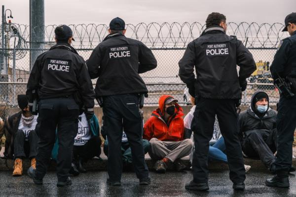 Port authority police in apprehend a suspect.