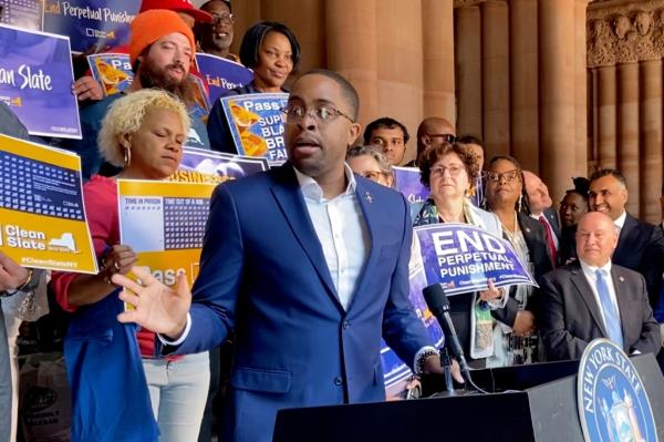 Zellnor Myrie gesturing at a NYS Capitol rally for the clean slate bill with lots of people standing behind him