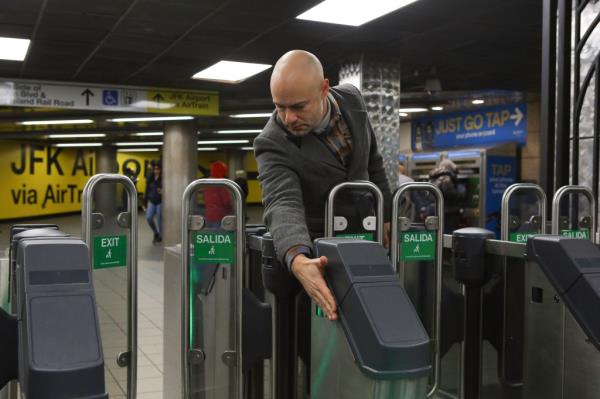 A Post reporter waves his hand in front of a sensor