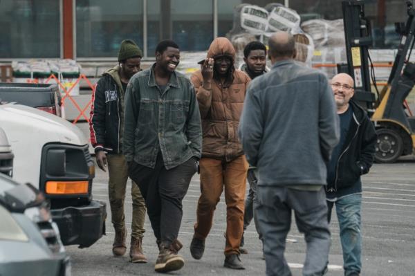 A group of migrants loitering in the parking lot of the Home Depot in Throggs Neck, The Bronx