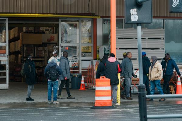 migrants loitering outside the entrance of the Home Depot in Throggs Neck, The Bronx