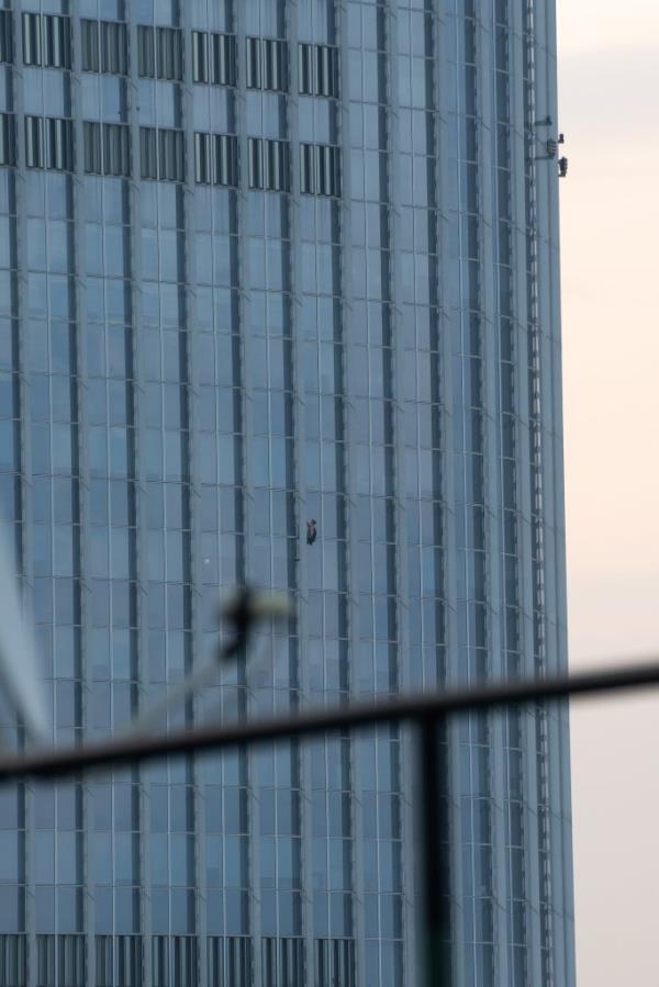 George King pictured free climbing the Lotte Tower in Seoul.