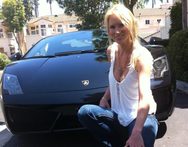 Tatyana Remley seen posing with her estranged husband's luxury sports car.