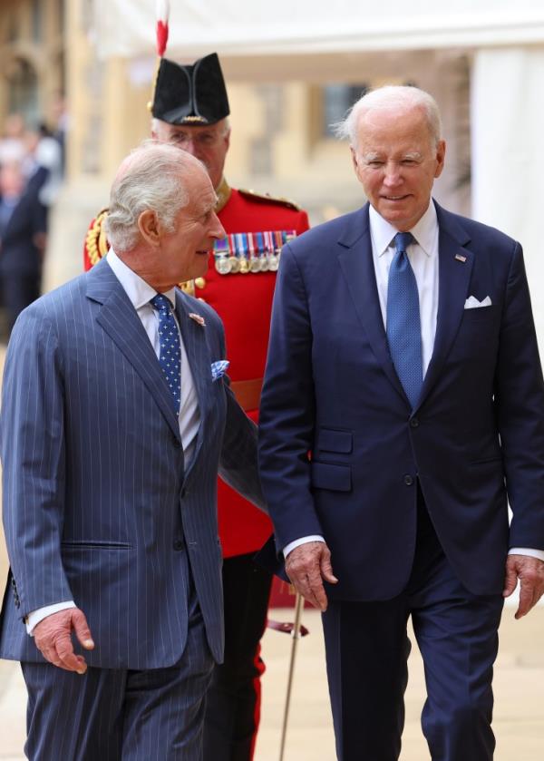King Charles III welcomes US President Joe Biden to Windsor Castle.
