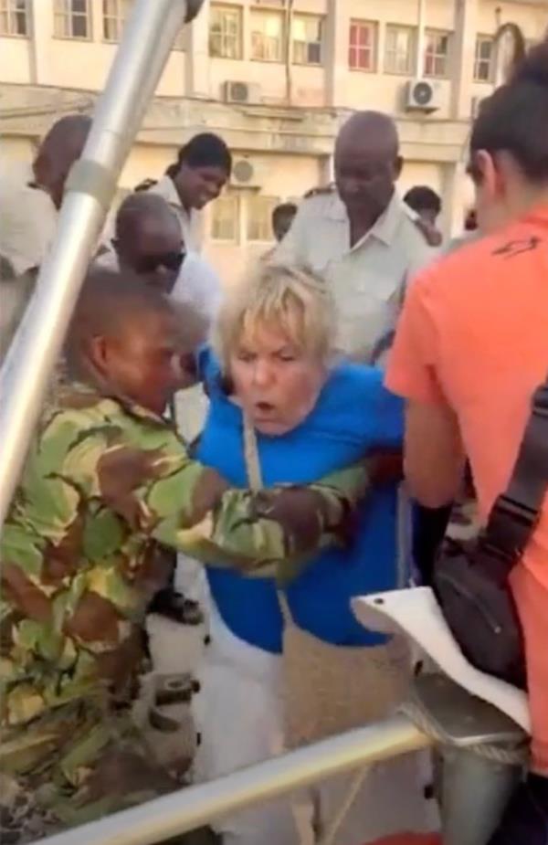 A passenger being refused to board the ship.