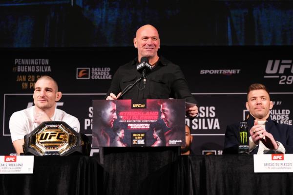 Sean Strickland, Driscus Du Plessis and Dana White are at a press conferernce. 
