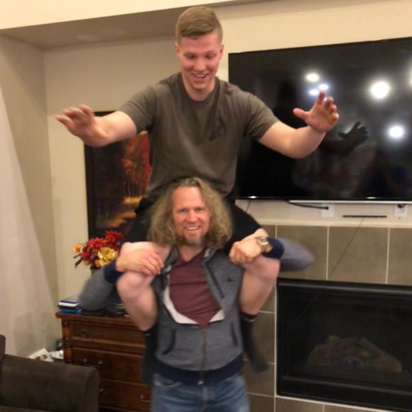 a person on someone's shoulders