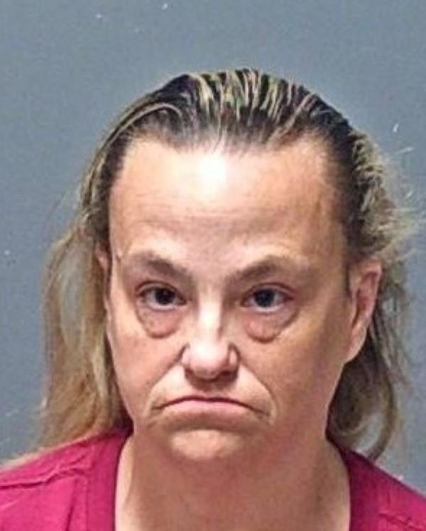 51-year-old suspect Traci Innie looking sad after being apprehended by police in a child endangerment case.