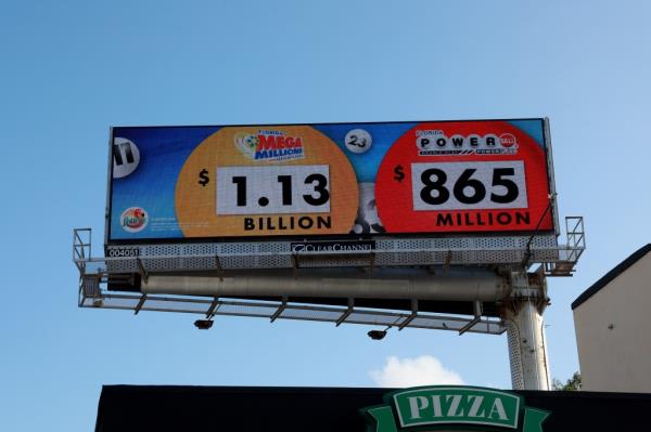 A billboard in Miami, Florida displays the jackpot prizes for both Mega Millions and Powerball on March 26, 2024.