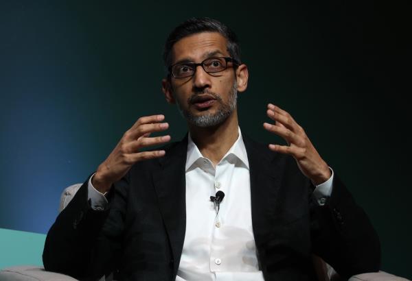 Google has laid off an unspecified number of workers and moved some positions overseas. Google CEO Sundar Pichai is seen above.