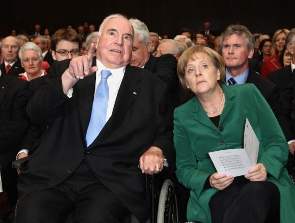 Helmut Kohl and Angela Merkel gesturing at official birthday reception for Kohl on May 5, 2010 in Ludwigshafen, Germany.