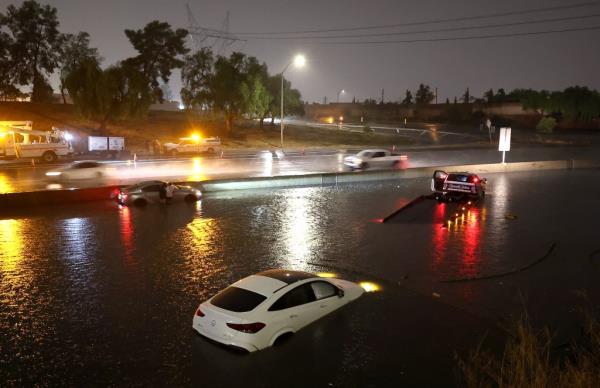 Car stuck in floodwaters brought by Tropical Storm Hilary on August 20, 2023.