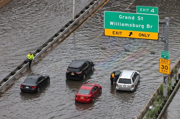 Police officers assisting motorists stuck on FDR Drive in Manhattan on Sept. 29, 2023.