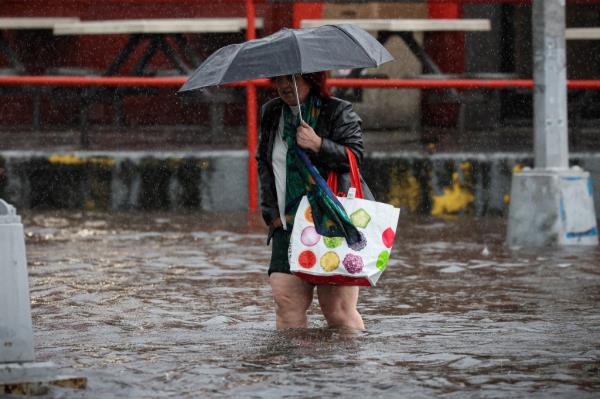 a flooded street in Brooklyn during rain brought by the remnants of Tropical Storm Ophelia on Sept. 29, 2023.