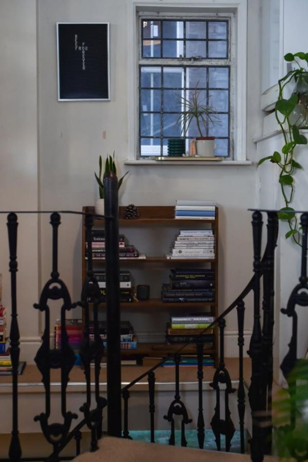 A wrought iron spiral staircase in the duplex