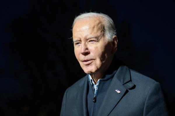 President Joe Biden answers a reporter's question as he walks from Marine One upon arrival on the South Lawn of the White House, Wednesday, Dec. 20, 2023, in Washington.