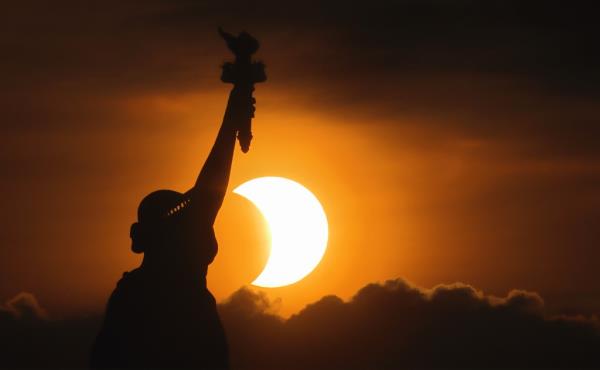 Statue of Liberty during annular solar eclipse on June 10, 2021
