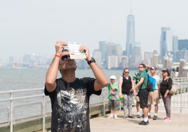 Man watches solar eclipse in New York