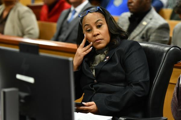Fulton County District Attorney Fani Willis appears before Judge Scott MacAfee for a hearing in the 2020 Georgia election interference case at the Fulton County Courthouse on November 21, 2023 in Atlanta, Georgia.