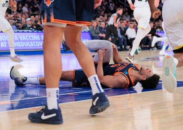 Quentin Grimes lies in pain during the Knicks' win over the Jazz on Jan. 30, 2024. 