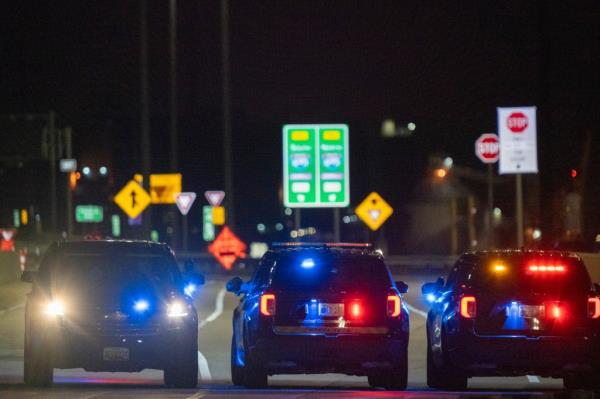 Baltimore Police Commissio<em></em>ner Richard Worley, with Mayor Brandon Scott (R) and Fire Department Chief James Wallace (L), speaks at a press co<em></em>nference on the collapse of the Francis Scott Key Bridge Baltimore,