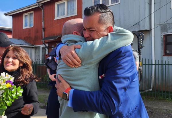 Jimmy Thyden, right, hugs his brother Pablo Leiva Go<em></em>nzalez as Maria Angelica Gonzalez, his Chilean birth mother, left, looks on in Valdivia, Chile on Aug. 17, 2023.