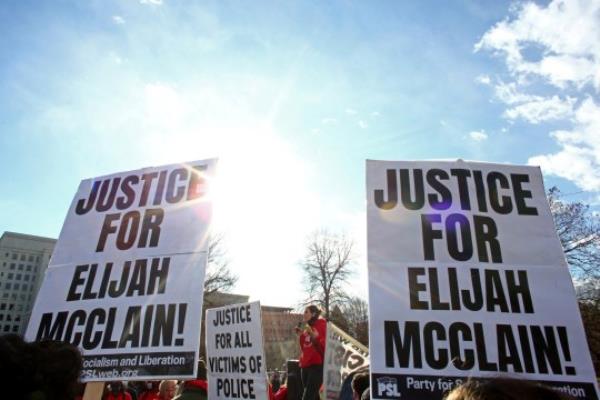 FILE PHOTO: Protesters gather for a rally to call for justice for Elijah McClain after Governor Jared Polis amended his executive order regarding the investigation of McClain's death, which has raised co<em></em>ncerns that charges against the police officers involved may ultimately be watered down in Denver, Colorado, U.S., November 21, 2020. REUTERS/Kevin Mohatt/File Photo