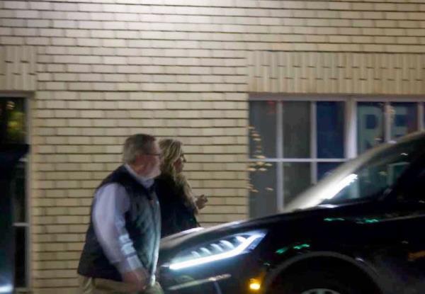 Jamie Lassiter, wife of North Carolina ex-councilman Scott Lassiter and Tim Moore are seen together at a December 2022 work event, in a photo submitted to the court  