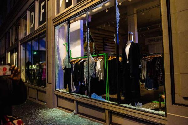 A clothing store is vandalized as police co<em></em>nfront protesters in Portland, Oregon on November 4, 2020, during a demo<em></em>nstration called by the 