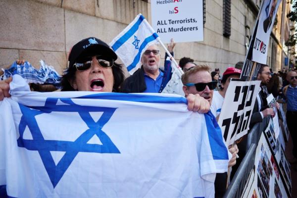 People gather during a rally on the Israel-Hamas co<em></em>nflict outside the Columbia University campuson Thursday, October 12, 2023
