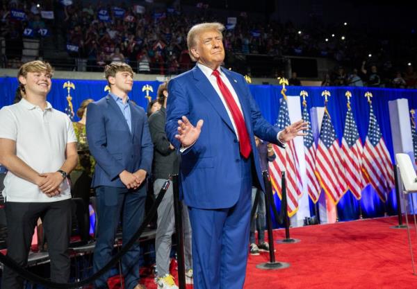 Do<em></em>nald Trump enters for a town hall event hosted by Tulsi Gabbard at the La Crosse Center.