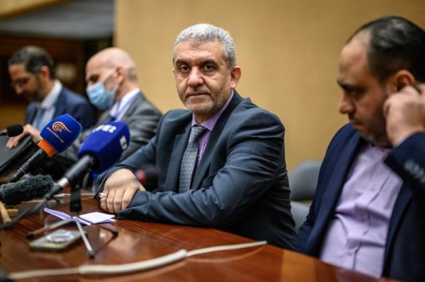 Lebanon Labor Minister Mustafa Bayram (C) looks on, during a press co<em></em>nference after filing a complaint to the Internatio<em></em>nal Labour Organization against Israel over the pager and walkie-talkie attacks carried out in last September, in Geneva on November 6, 2024. 