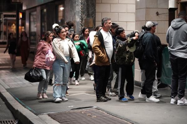 Migrants and support perso<em></em>nnel seen outside of the Roosevelt Hotel in New York, NY on June 3.