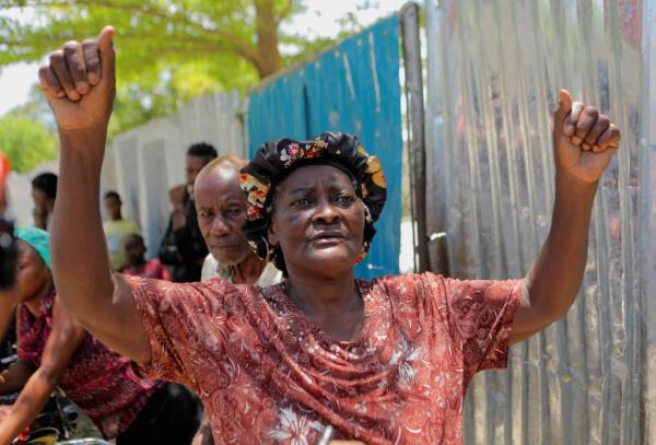 Luitesse Desume reacts after U.S. nurse Alix Dorsainvil, from the humanitarian aid organization El Roi Haiti, and her child were safely released following their kidnapping in Haiti two weeks ago, outside the installations of El Roi Haiti in Cite Soleil, in Port-au-Prince, Haiti August 9, 2023