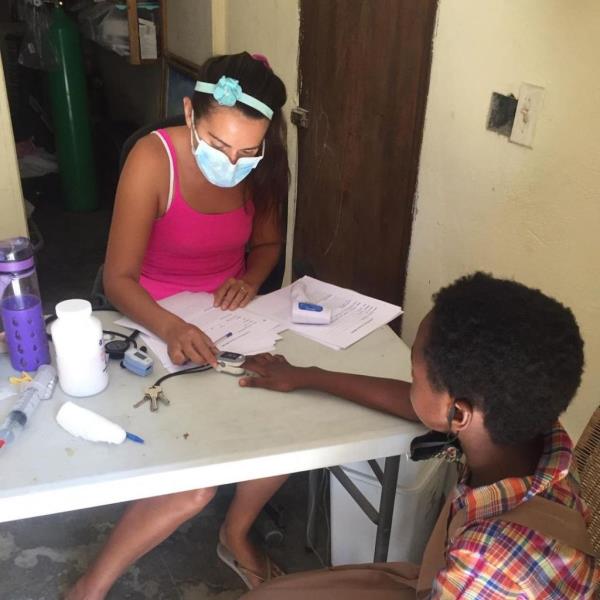 Alix Dorsainvil seen treating a patient 