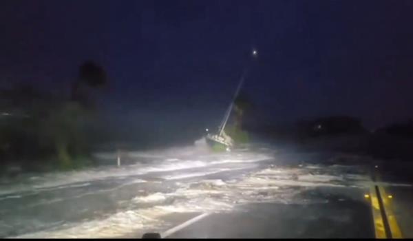 Trees were toppled and a sail boat was pushed close to a road on Thursday, September 26, as Hurricane Helene barrelled towards Florida.