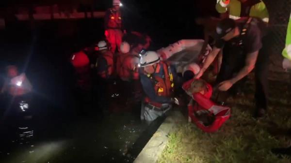Rescue crews pulled three people and a dog from floodwaters in Hillsborough County, Florida, as Hurricane Helene hit the region on Thursday, Sept. 26.