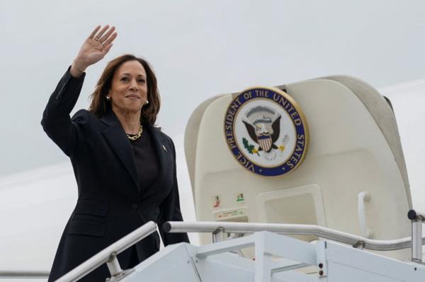 Vice President Kamala Harris waves as she boards Air Force Two following a campaign event in Pittsburgh, Pennsylvania, U.S., September 25, 2024.