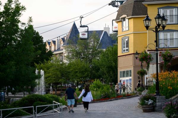 People walk at Mont-Tremblant Resort in Mont-Tremblant, Quebec.
