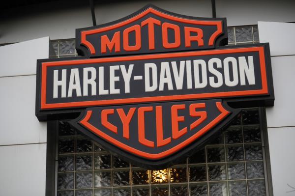 Harley Davidson company logo hanging over the entrance of a dealership in Littleton, Colorado