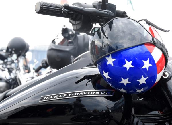 A helmet resting on a Harley Davidson motorcycle during the Hamburg Harley Days meetup in Germany