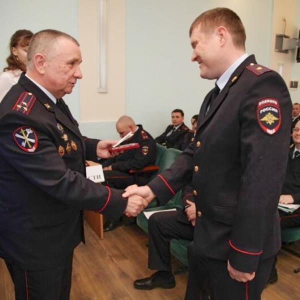 Lieutenant Colo<em></em>nel Alexei Chernykh, 39, pictured right
