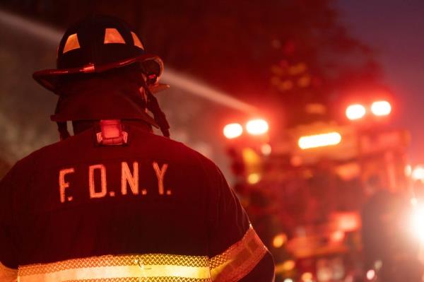 FDNY firefighters work to supress the brushfire. 