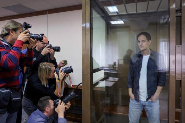 Wall Street Journal reporter Evan Gershkovich stands inside an enclosure for defendants before a court hearing to co<em></em>nsider an appeal against his pre-trial detention on espio<em></em>nage charges in Moscow, Russia, October 10, 2023.