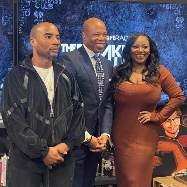 Mayor Eric Adams, center, attorney Olayemi Olurin, right, and radio host Charlamagne Tha God, left